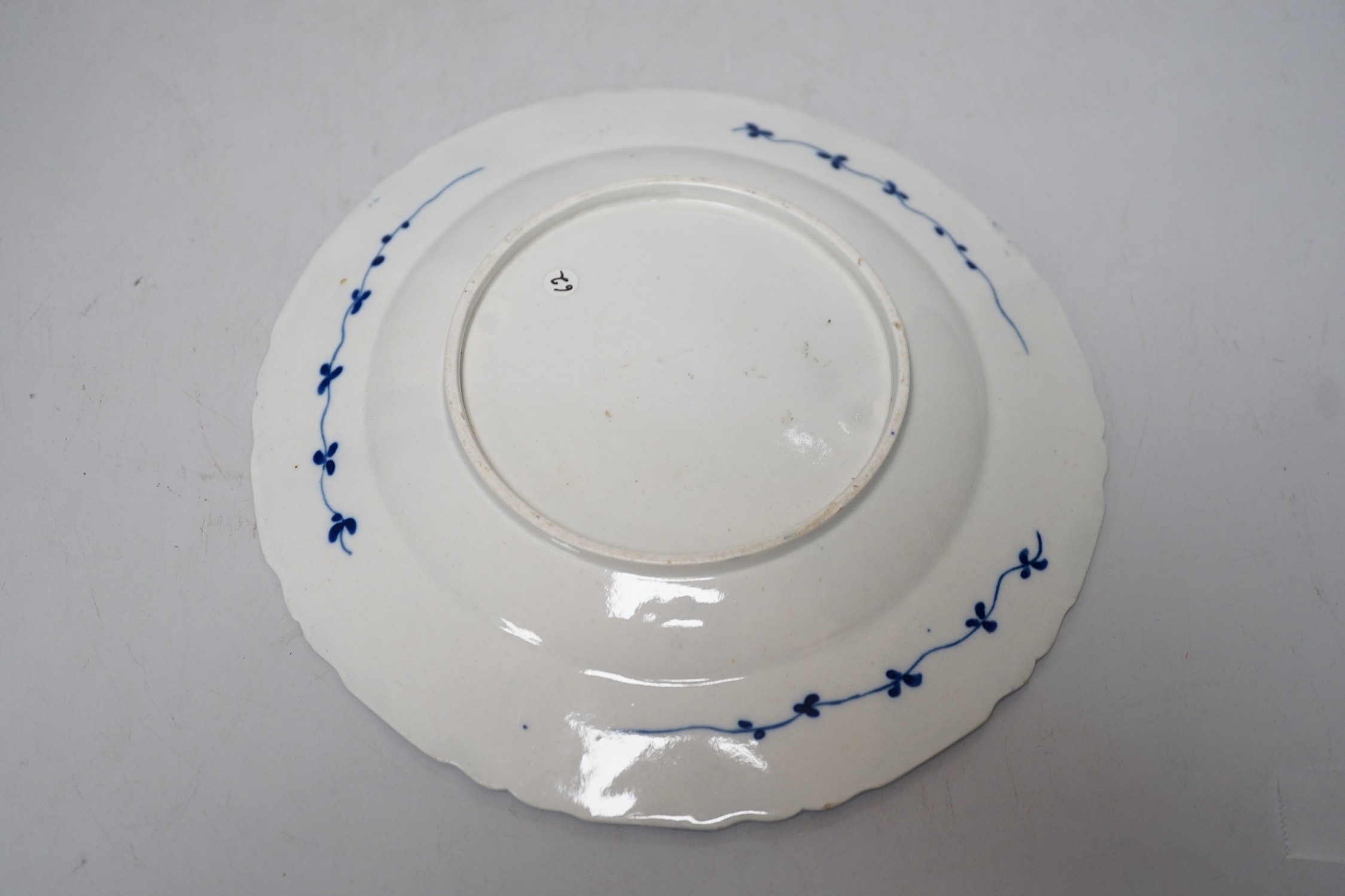 An 18th century Caughley plate painted, with bright, sprigs, impressed mark Salopian, 19.5cms diameter